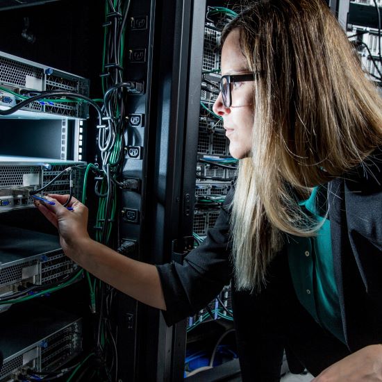 Female engineer working in server room 3